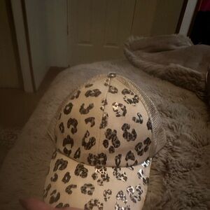 Leopard woman’s hat. With ponytail hole in back